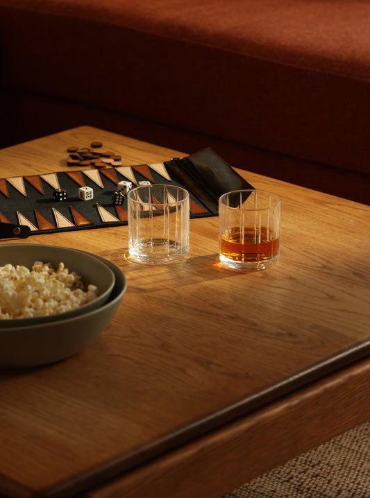 Rock glasses and a table game on the table