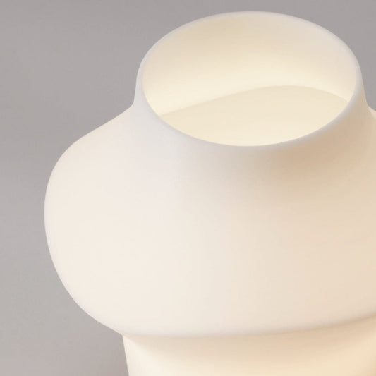 Curve table light lighting by Fable Home, in a translucent color. – #translucent