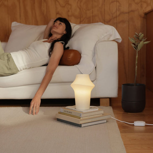 Curve table light lighting by Fable Home, in a translucent color. – #translucent