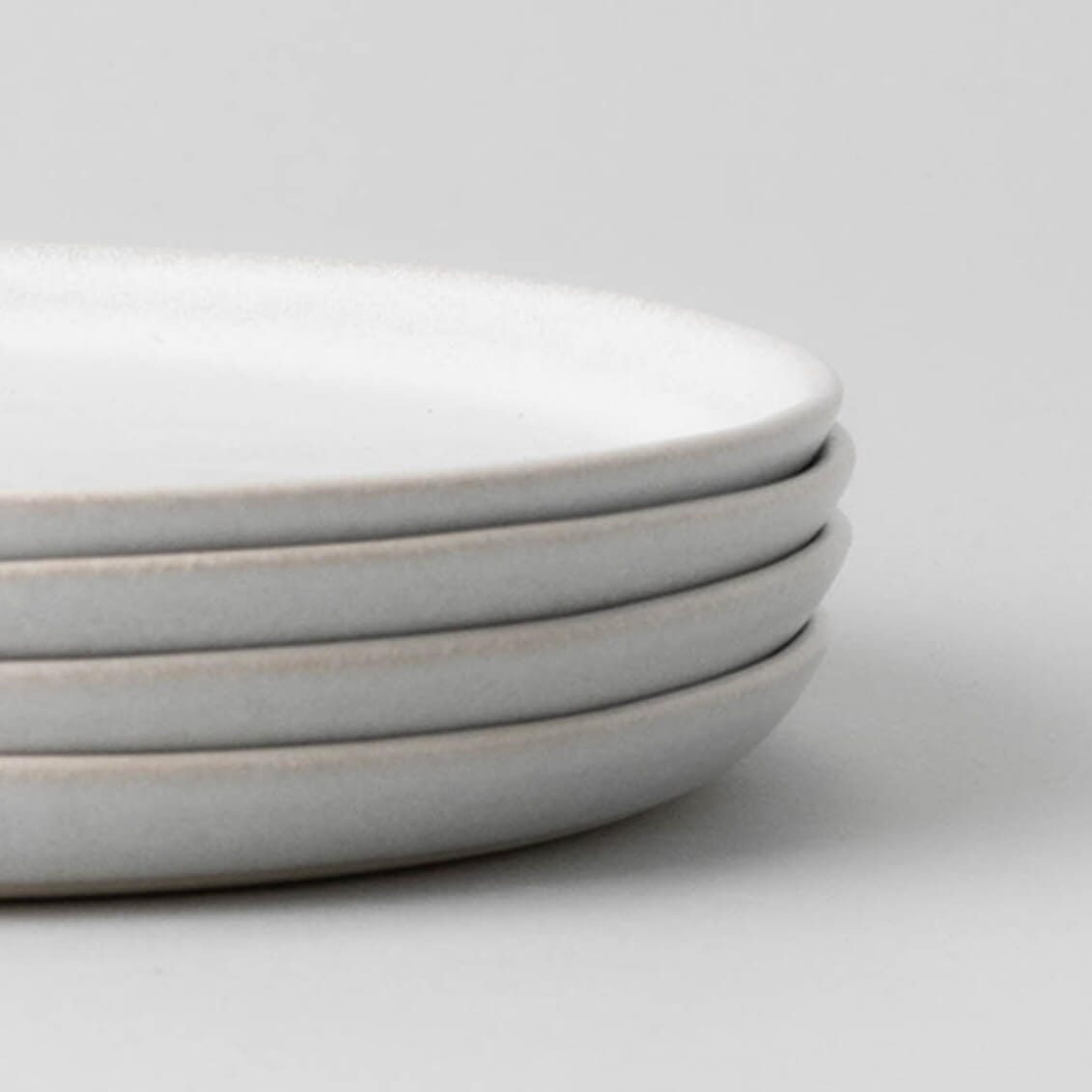 Salad plates dinnerware by Fable Home, shown in a stoneblue finish, .