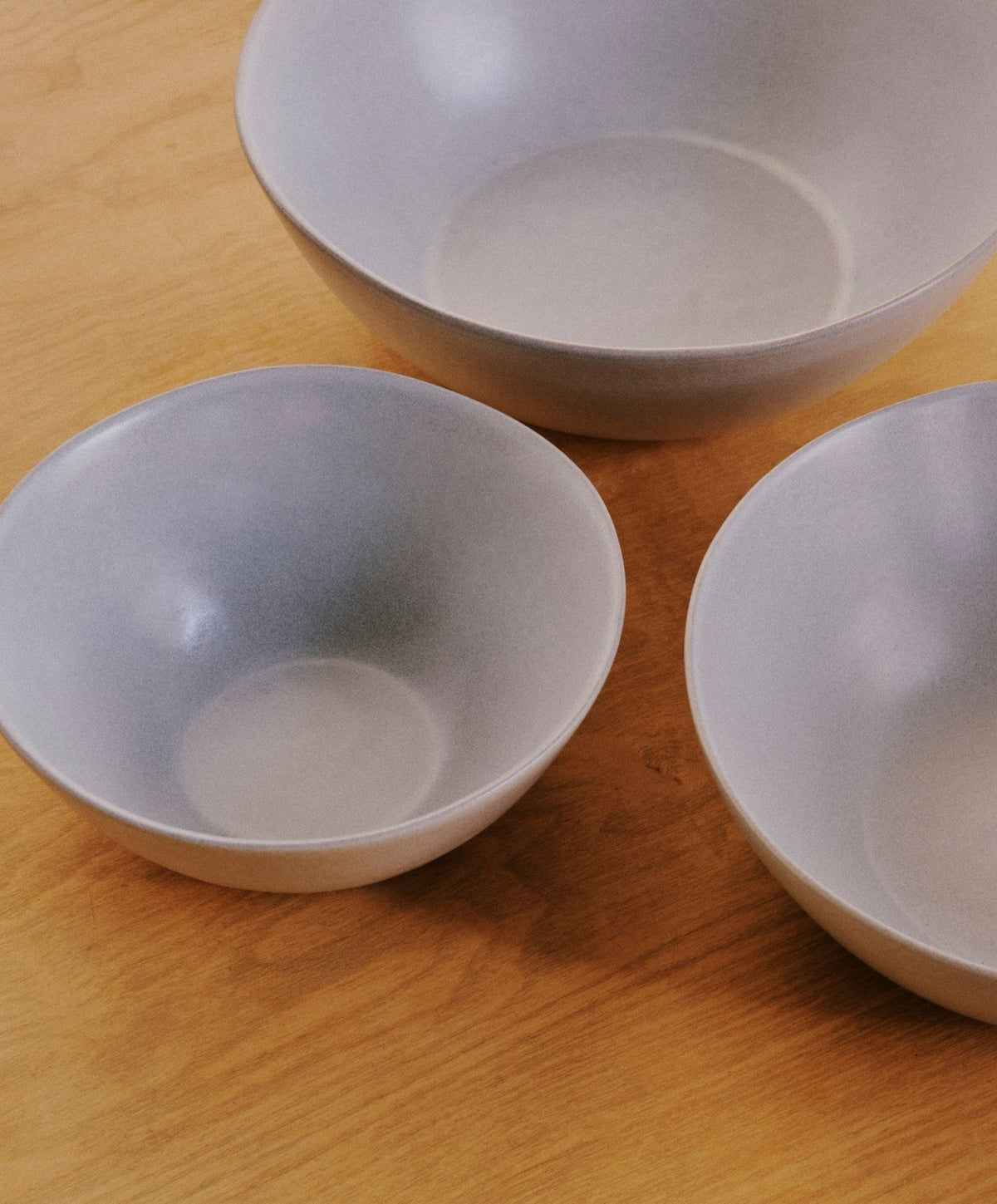 Nested Serving Bowls by Fable Home, shown in Stone Blue.