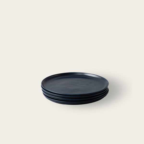Salad plates dinnerware by Fable Home, shown in a midnightblue finish. – #midnightblue