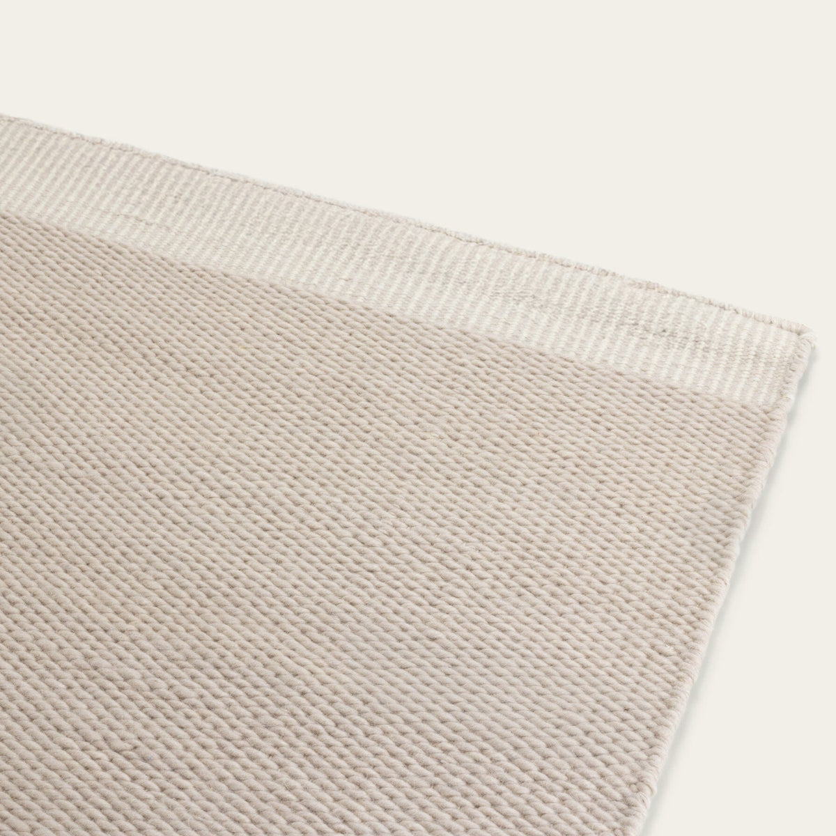 Close-up of a Dune gray wool rug showing the texture and weave. #dunegray