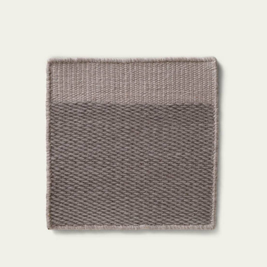 Broun textured rug on a light gray background, #slategray